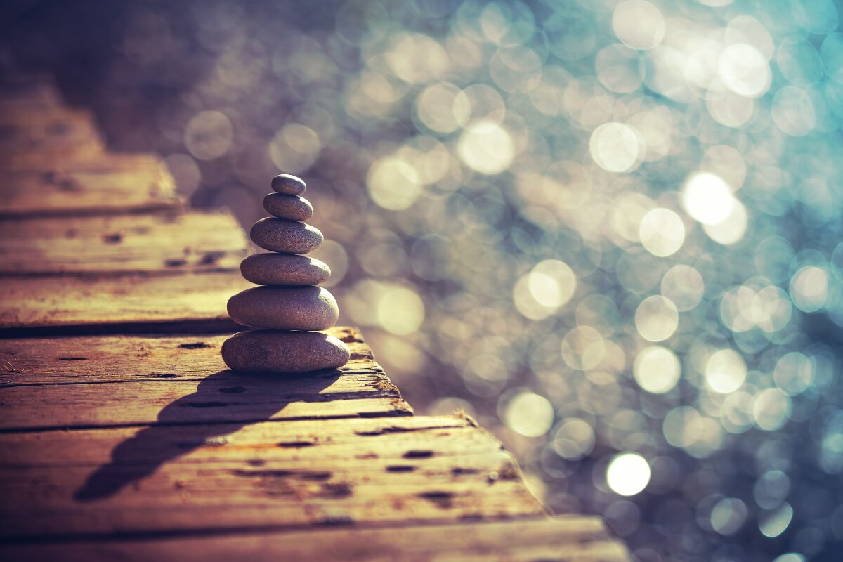 Different sizes of stone arranged beautifully in a brigde under the sunset. How to manage anger: Strategies to regulate your anger.